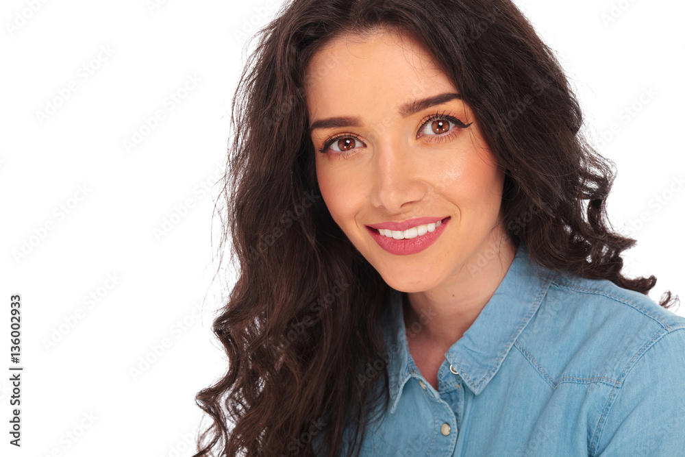 closeup picture of a smiling casual woman with curly hair closeup picture of a smiling casual woman with curly hair