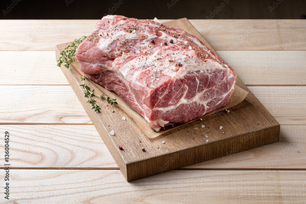 Photo of raw meat. Pork neck with herbs