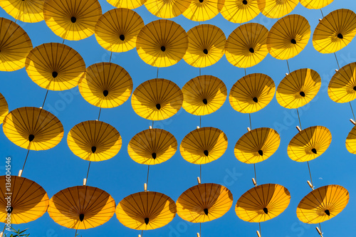 Yellow umbrellas on blue sky