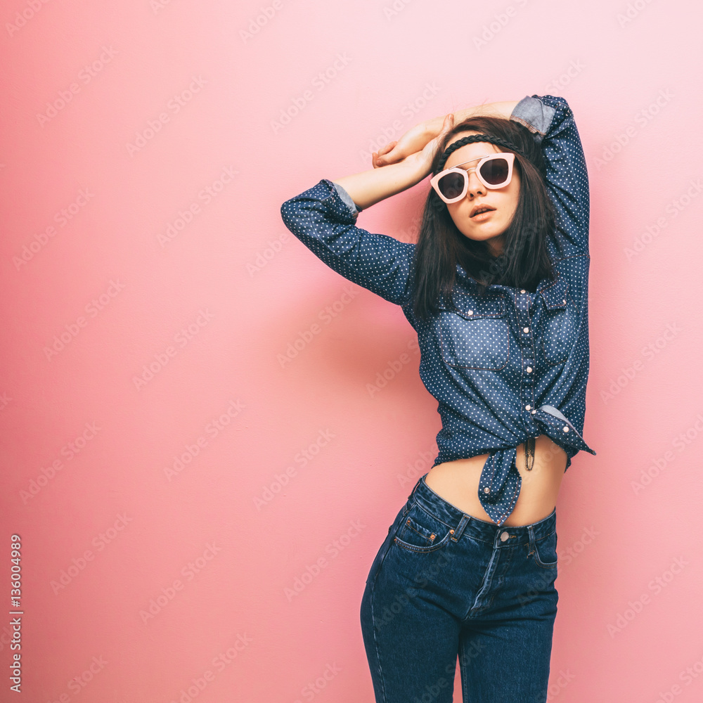 Beautiful Young Model Wearing Denim Shirt And Jeans Posing Outdoor Near  Orange Wall Background. Stock Photo, Picture and Royalty Free Image. Image  56796921.