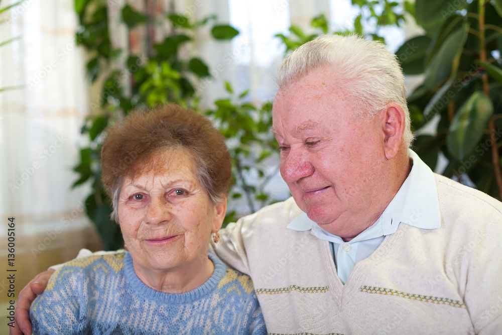 Smiling elderly couple at home Smiling elderly couple at home