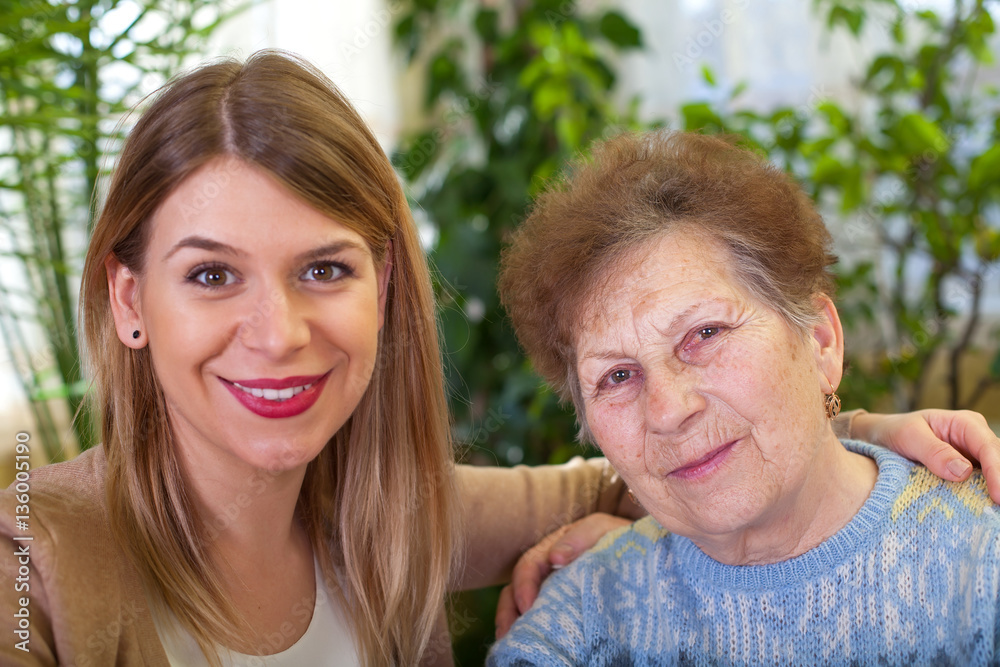 Senior lady with her beautiful granddaughter Senior lady with her beautiful granddaughter