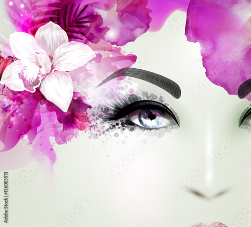 Beautiful young woman looks straight. Light blooming orchid decorated abstract pink hair.