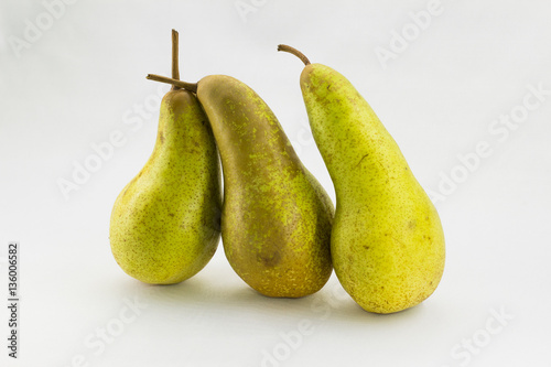 Three Abate Fetel pears isolated on white background. photo