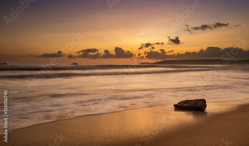 Fototapeta Naklejka Na Ścianę i Meble -  An  orange glow sunrise over the south China sea off the coast of Vietnam.