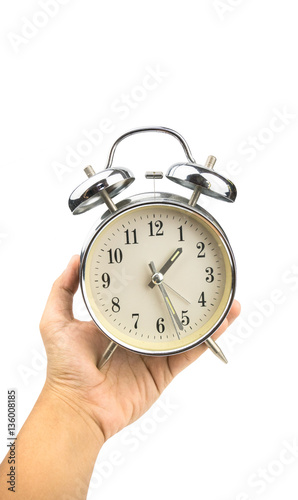 Desk clocks in hand on white background,clipping - path.