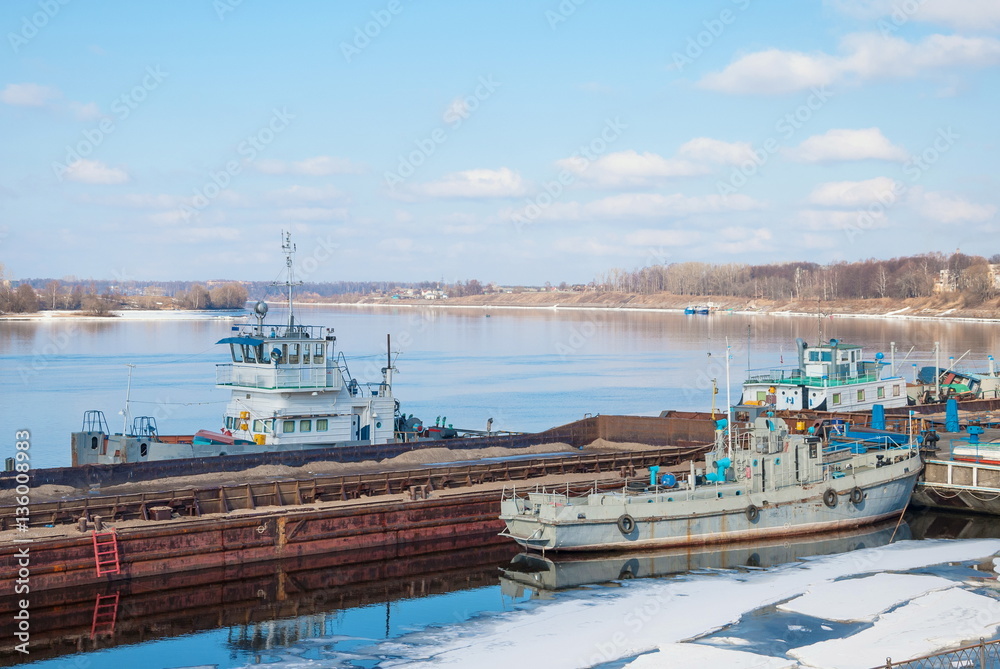 small port with boats in the spring Volga River in the ancient Russian town of Uglich