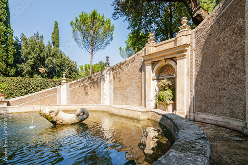 Sunny view of one of the fountains at the garden in Villa d`Este, Tivoli near Roma, Lazio region, Italy. photo