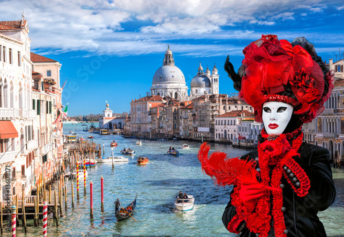 Famous Carnival mask against Grand Canal in Venice, Italy