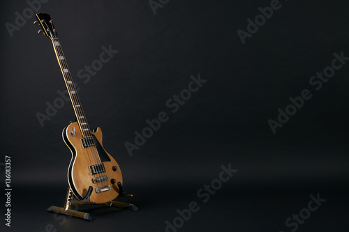 Bass guitar isolated on black background with copy space.