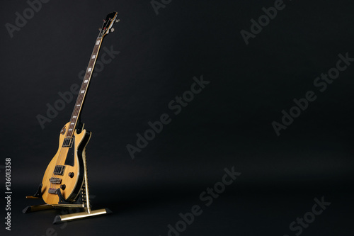 Bass guitar isolated on black background with copy space.