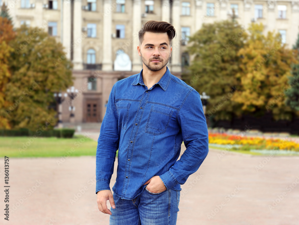 Handsome man on street background Handsome man on street background