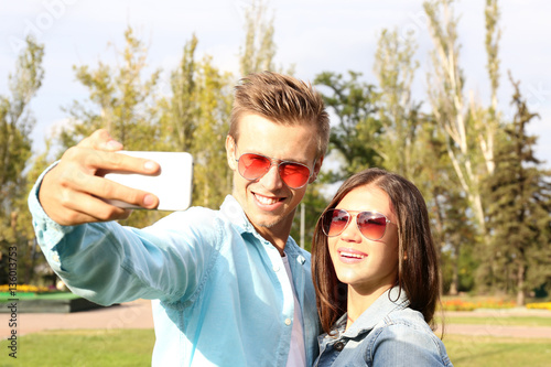 Beautiful young couple taki...
