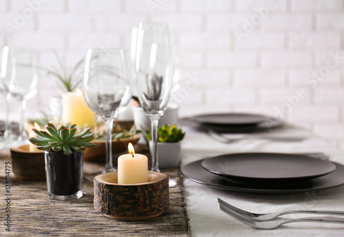 Table served with succulents for dinner in living room