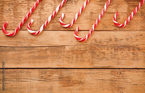 Christmas candies on wooden background