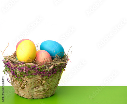 Easter eggs and wicker basket