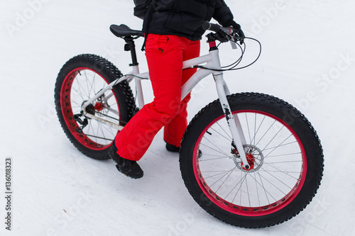 Woman on bicycle at winter