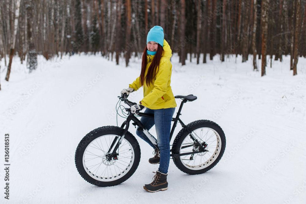 Young girl at winter cycling