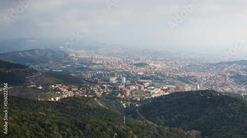 Mist over the Barcelona city © castenoid