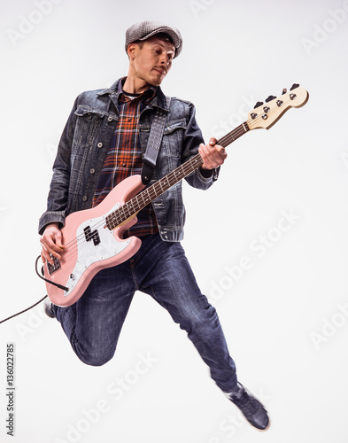 Bassist plays bass guitar.