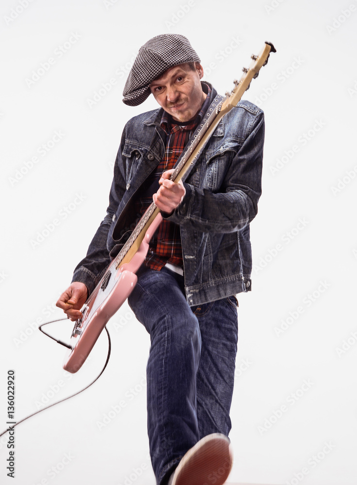 Bassist plays bass guitar. Bassist plays bass guitar.