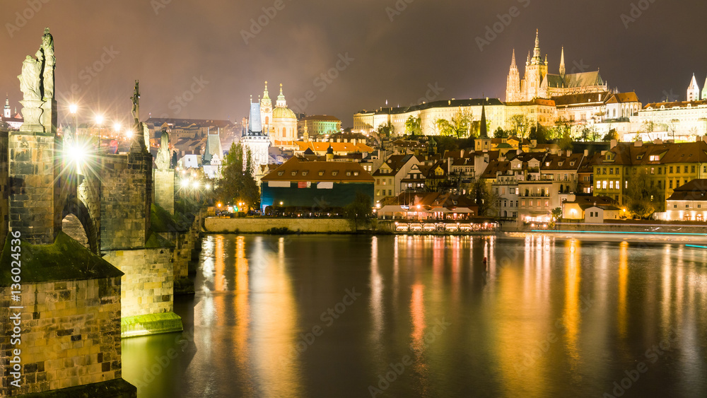 Night cityscape of Prague near Charles Bridge, Capital of Czechia.