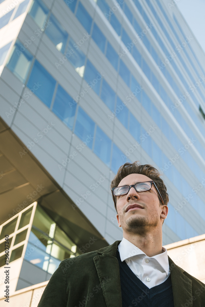 Young handsome man posing in an urban context Young handsome man posing in an urban context