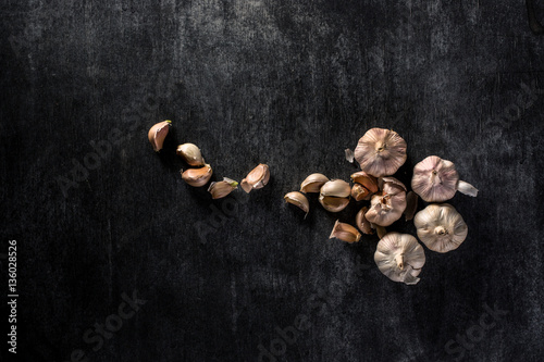 Photo of a garlic over dark background