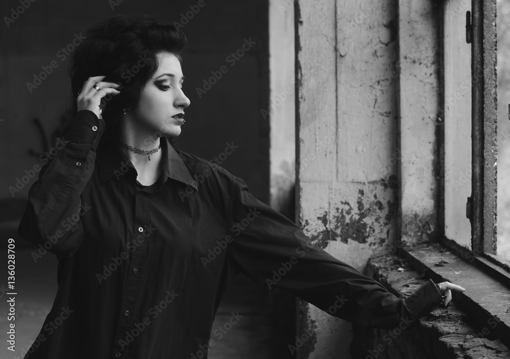 Portrait of beautiful lonely and sad goth girl in abadoned building Portrait of beautiful lonely and sad goth girl in abadoned building