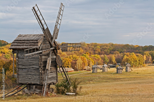 Old wooden windmill in the countryside in autumn season