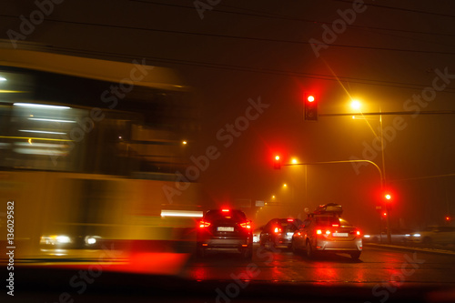 Driving a car in bad weather conditions, a car is blocking crossroad