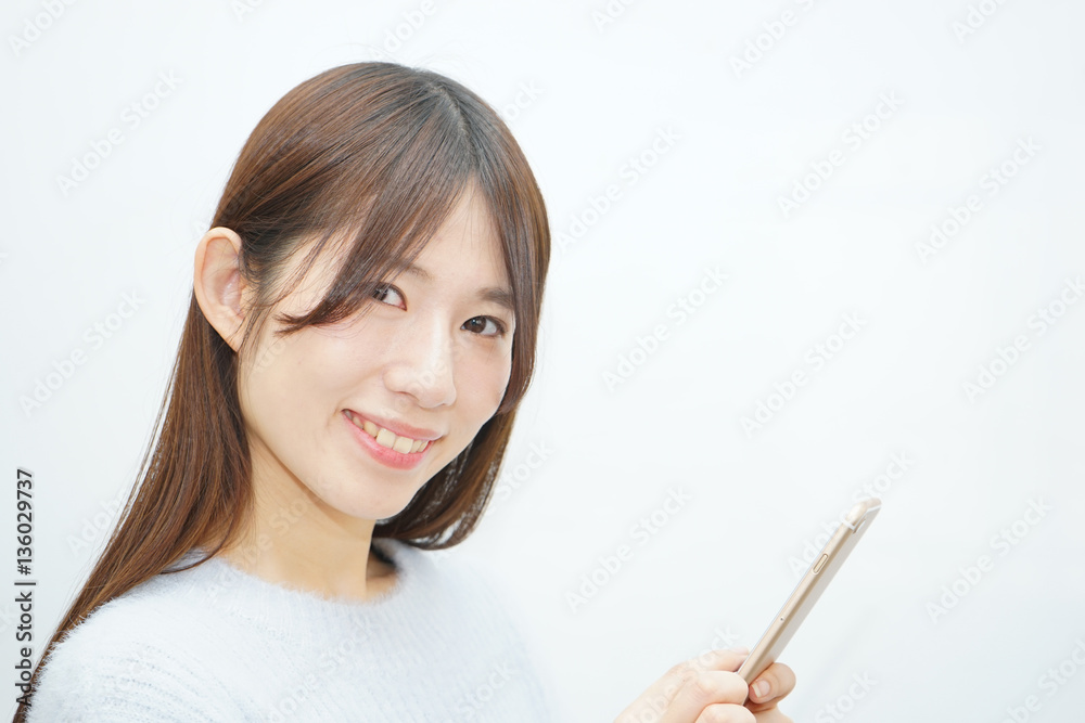 Young woman using a smart phone with smile Young woman using a smart phone with smile