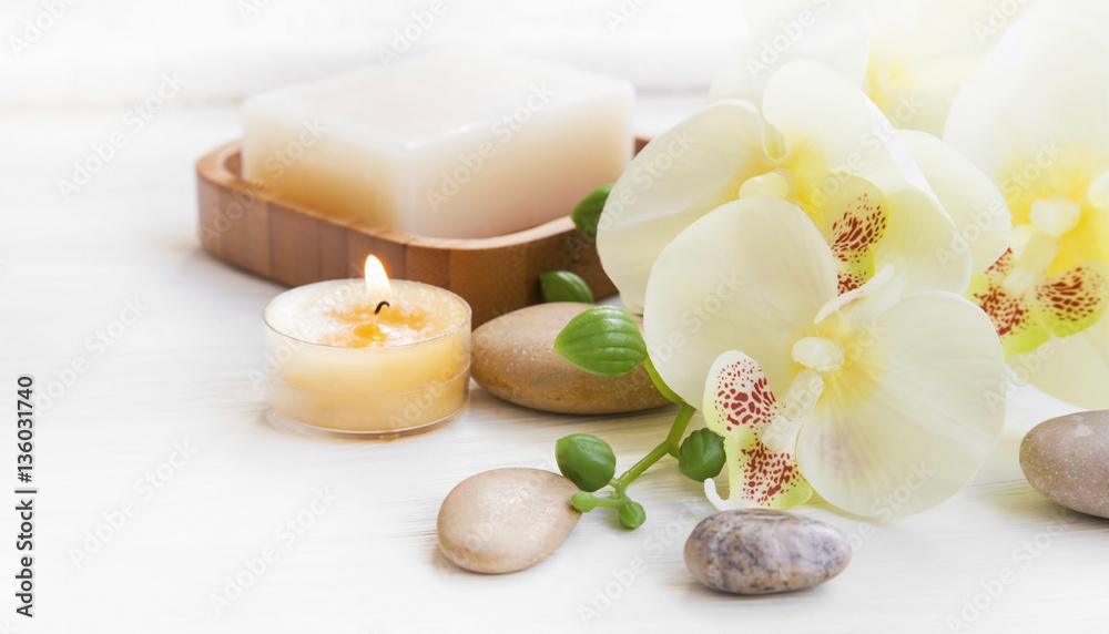 Spa set with orchid, candle and massage stones