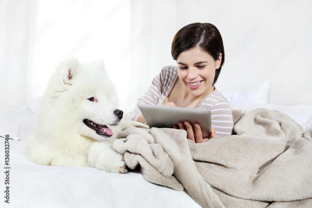 smiling woman with pet dog and tablet smiling woman with pet dog and tablet