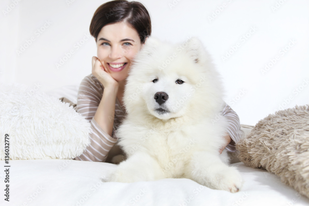 Smiling woman with pet dog