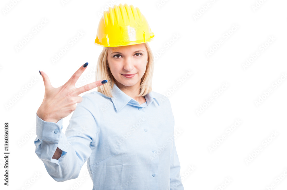 Female architect showing number three gesture Female architect showing number three gesture