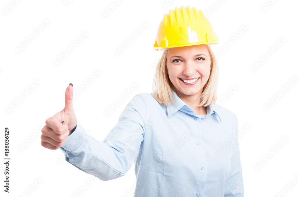 Female engineer showing like gesture and smiling Female engineer showing like gesture and smiling