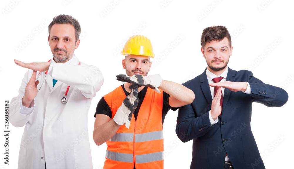 Cheerful men doing time out gesture Cheerful men doing time out gesture