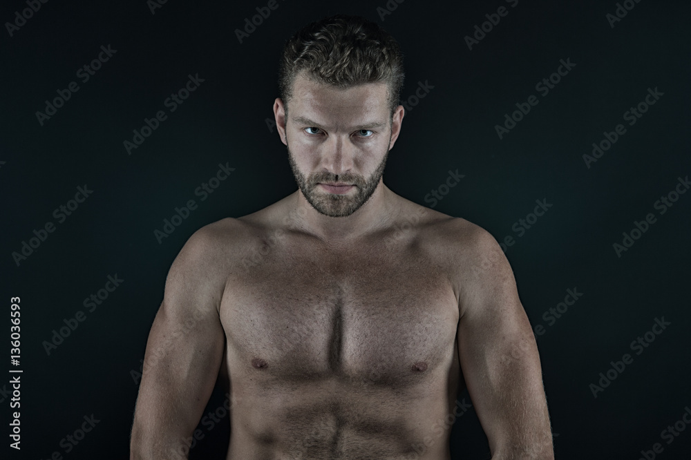 handsome sexy man with muscular body and serious unshaven face handsome sexy man with muscular body and serious unshaven face
