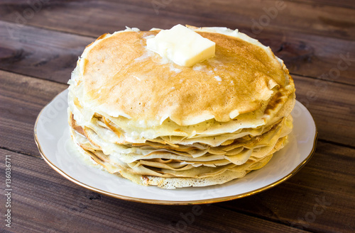 fresh homemade stack of crepes with butter