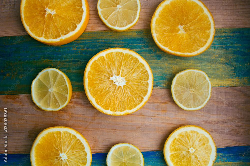 slices of lemon and orange on a wooden table