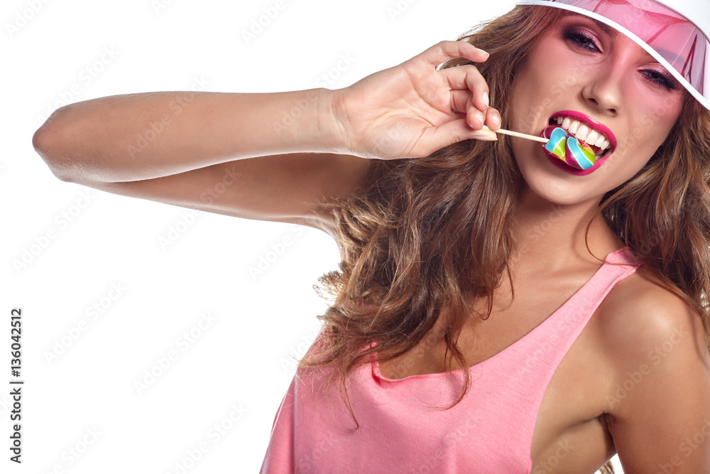 Beautiful amazing sexy smiling woman with a lollipop on white ba