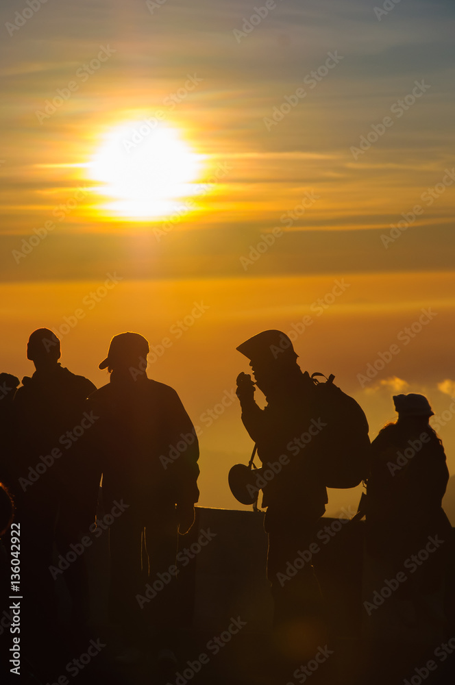 Sunrise  and silhouette people