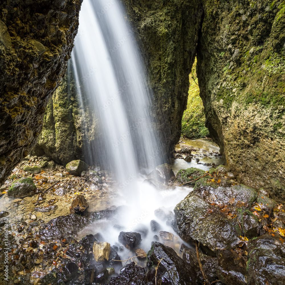 Beautiful waterfall in a narrow gorge. Beautiful waterfall in a narrow gorge.