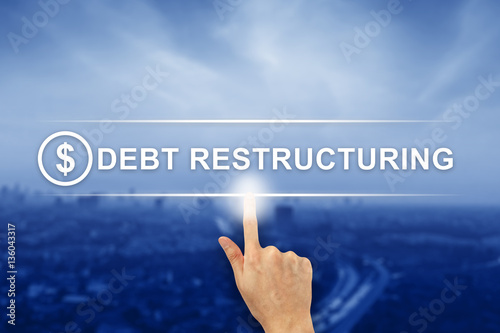 hand clicking Debt restructuring button on touch screen photo