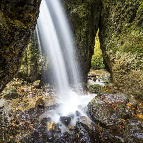 Beautiful waterfall in a narrow gorge.