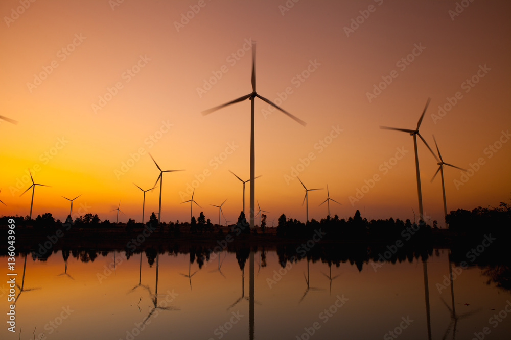 Obraz premium Wind turbine power generator at twilight