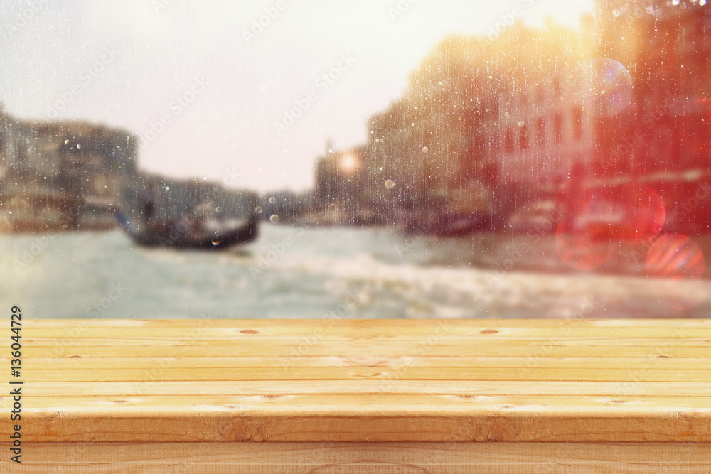 Empty table in front of blurry romantic venice background Empty table in front of blurry romantic venice background
