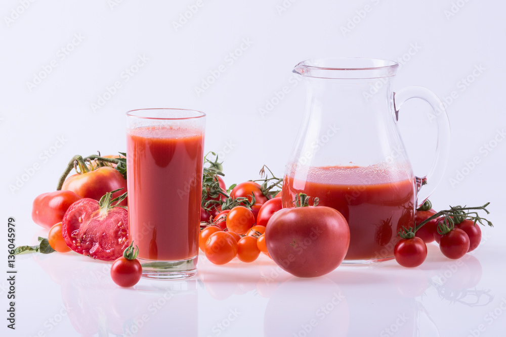 Ripe tomatoes and juice Ripe tomatoes and juice