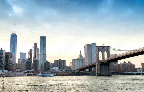 Downtown Manhattan  and Brooklyn Bridge panorama at dusk, New Yo © jovannig